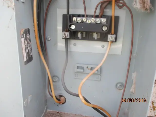 An electrical panel with a junction block, photographed during an Alert inspection