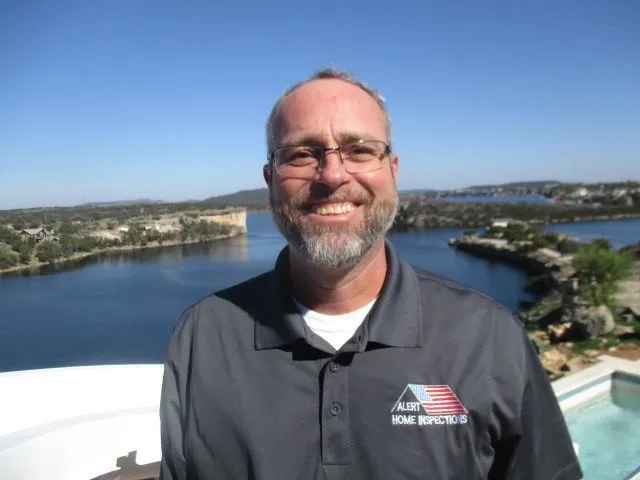 Darren Lee in a dark Alert Home Inspections polo