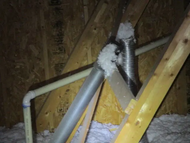 Flex duct and PVC lines running across attic insulation